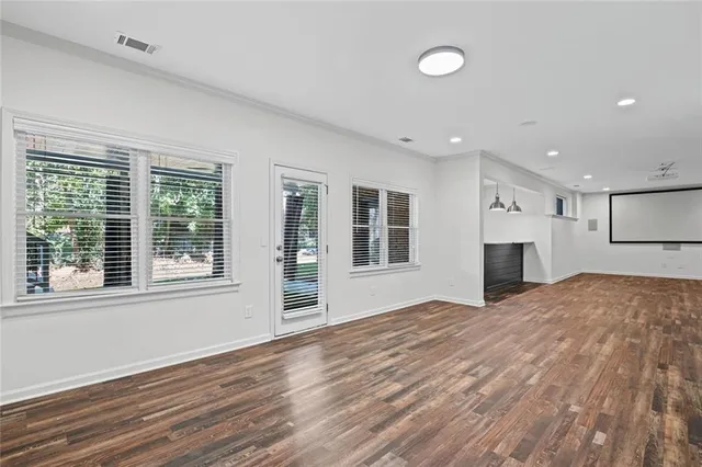 a aerial view of a house next to a yard
