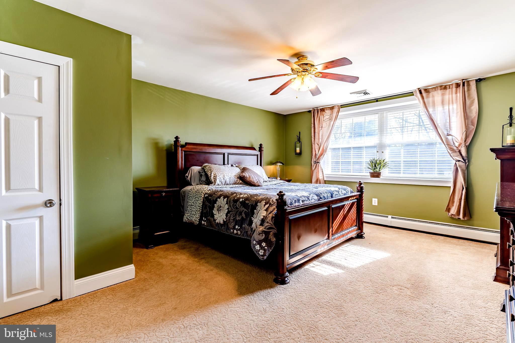 411 Linville Road Media, PA 19063 - Photo 12 of 33 Master bedroom with newer carpet and ceiling fan