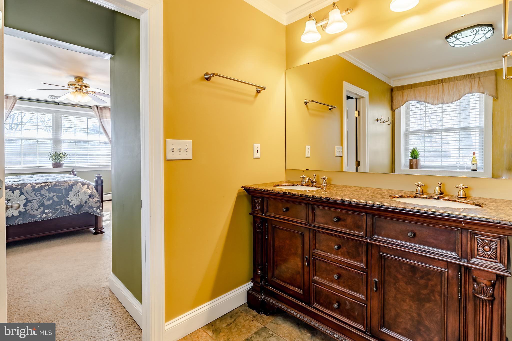 411 Linville Road Media, PA 19063 - Photo 17 of 33 Master bathroom with large cherry vanity