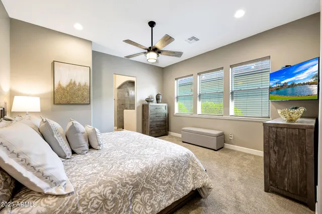 a bedroom with a large bed and a window