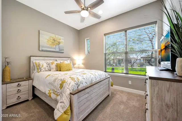 a bed room with a bed and a window