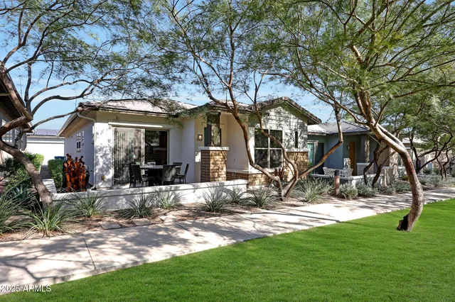 a view of a house with yard and tree s