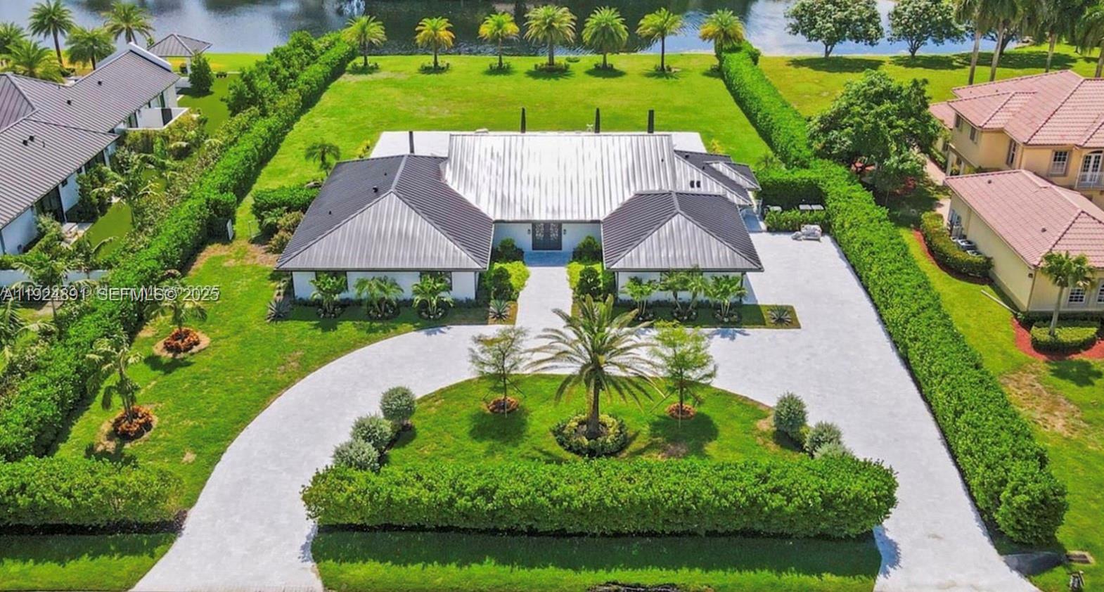 17873 Fieldbrook Circle East Boca Raton, FL 33496 - Photo 11 of 26 an aerial view of house with swimming pool patio and lake view