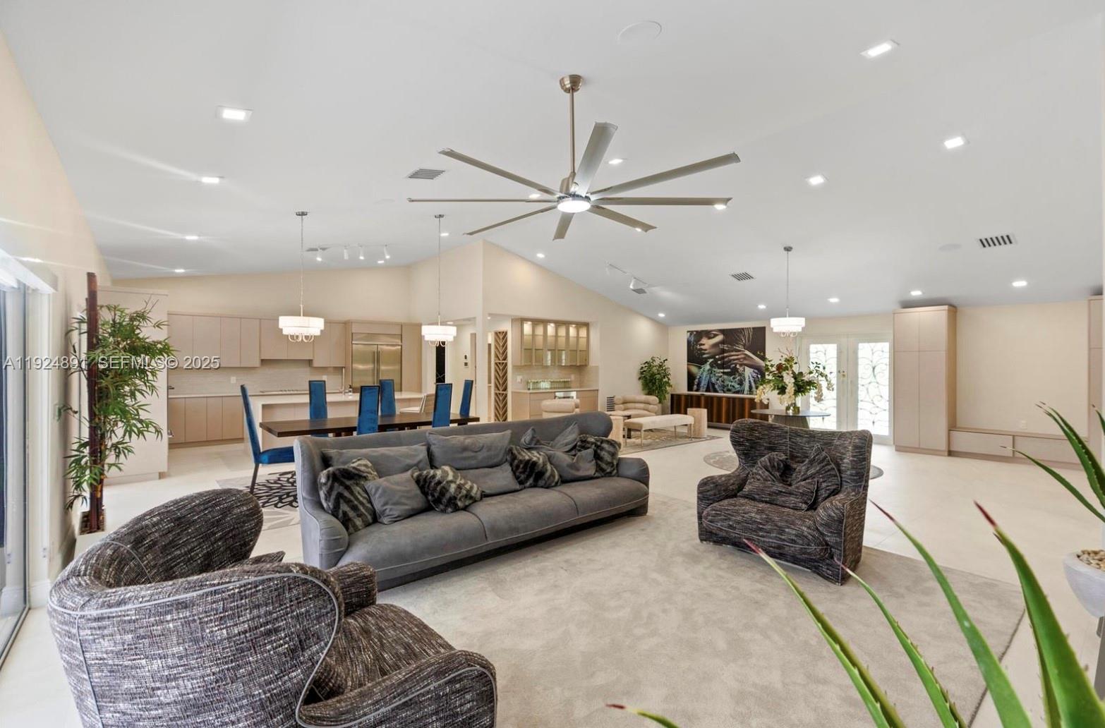 17873 Fieldbrook Circle East Boca Raton, FL 33496 - Photo 2 of 26 a living room with furniture ceiling fan and a rug