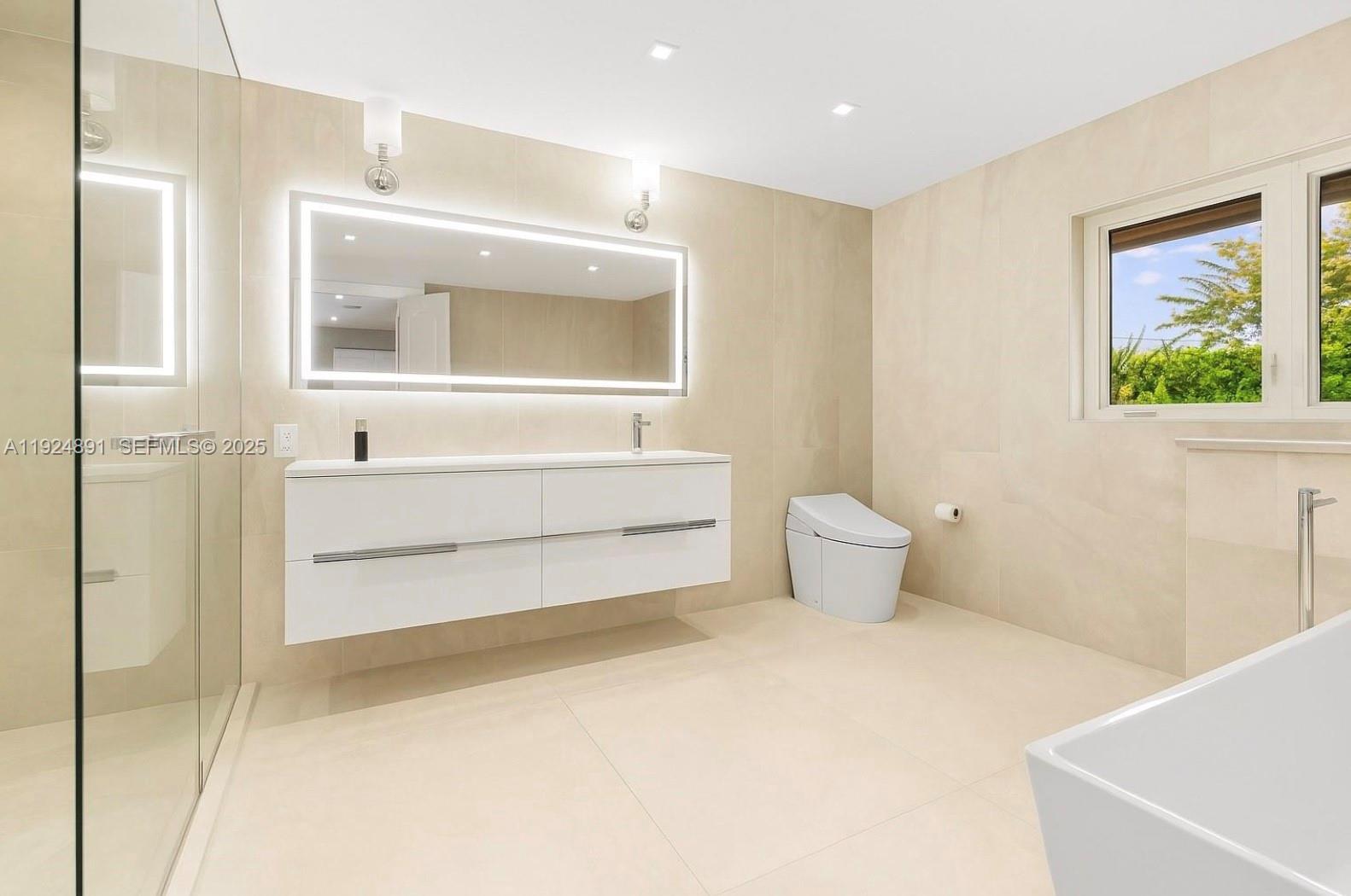 17873 Fieldbrook Circle East Boca Raton, FL 33496 - Photo 21 of 26 a bathroom with a sink and a mirror