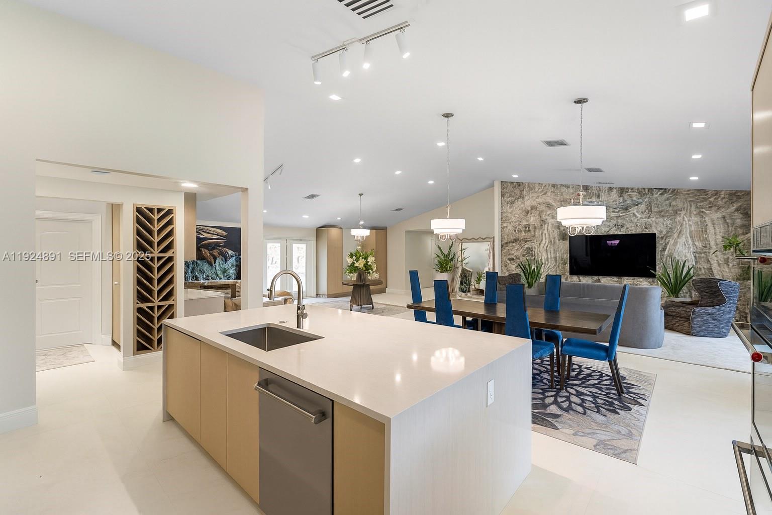 17873 Fieldbrook Circle East Boca Raton, FL 33496 - Photo 6 of 26 a kitchen with stainless steel appliances kitchen island granite countertop a sink and a refrigerator
