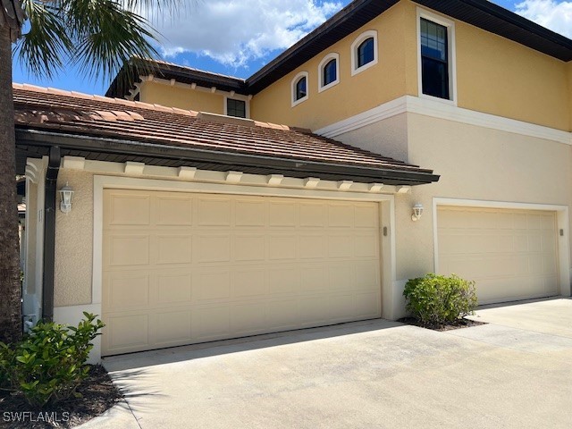 10455 Casella Way, Unit 202 Fort Myers, FL 33913 - Photo 1 of 41 a view of backyard with potted plants