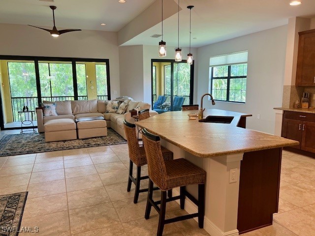 10455 Casella Way, Unit 202 Fort Myers, FL 33913 - Photo 11 of 41 a view of a dining room with furniture window and outside view