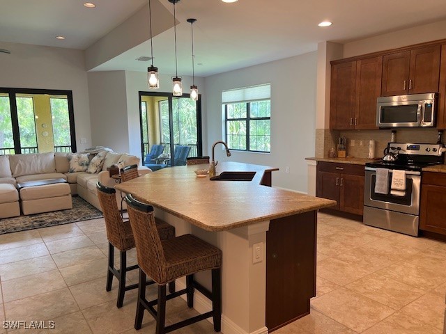 10455 Casella Way, Unit 202 Fort Myers, FL 33913 - Photo 12 of 41 a view of a dining room with furniture window and outside view