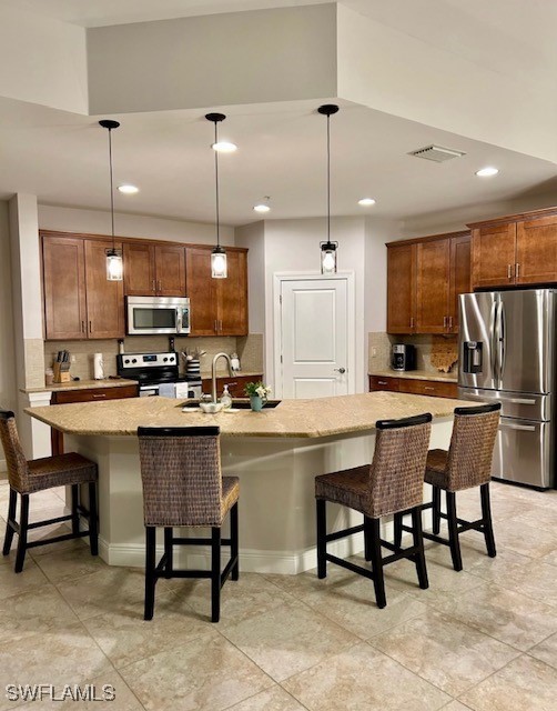 10455 Casella Way, Unit 202 Fort Myers, FL 33913 - Photo 14 of 41 a kitchen with kitchen island a dining table chairs and white cabinets