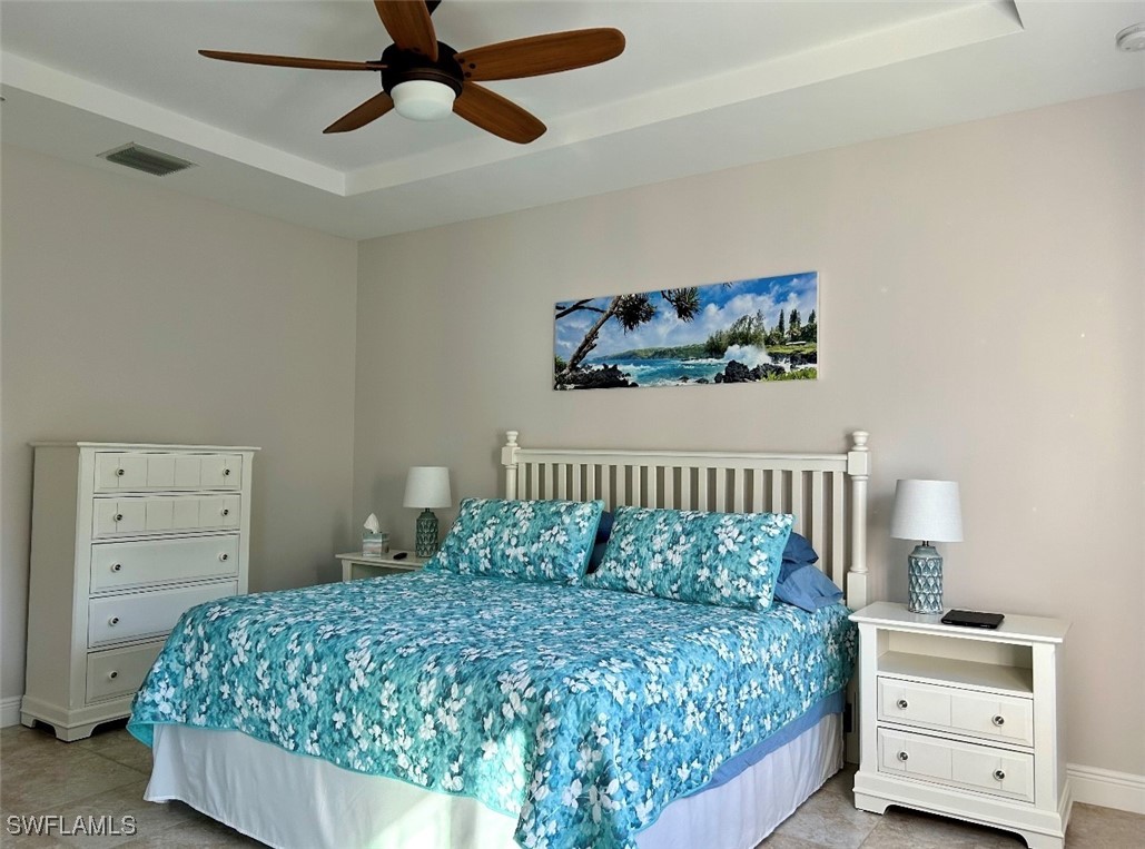 10455 Casella Way, Unit 202 Fort Myers, FL 33913 - Photo 19 of 41 a bedroom with a bed and a dresser