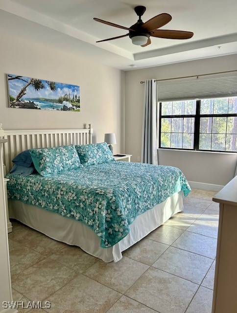 10455 Casella Way, Unit 202 Fort Myers, FL 33913 - Photo 20 of 41 a bed sitting in a room next to a window