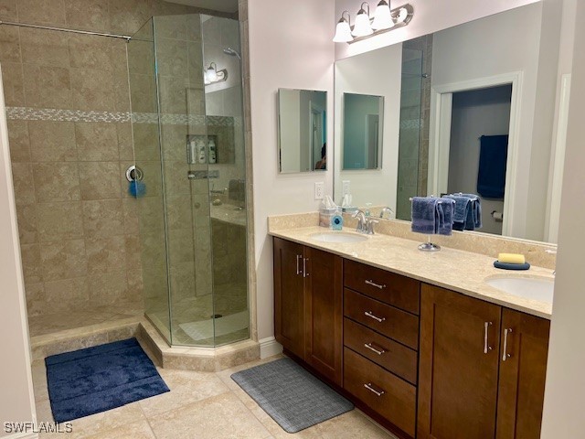 10455 Casella Way, Unit 202 Fort Myers, FL 33913 - Photo 22 of 41 a bathroom with a double vanity sink toilet and shower