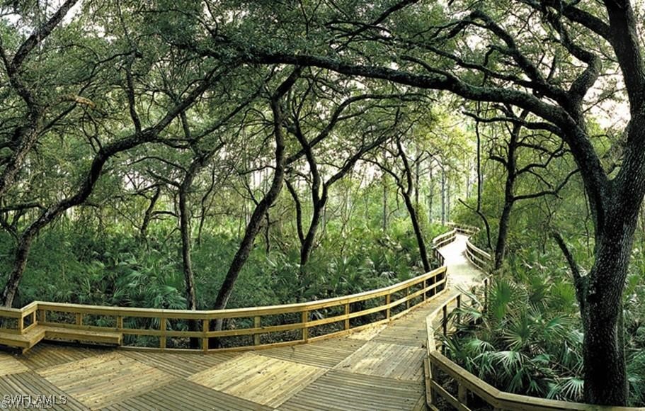 10455 Casella Way, Unit 202 Fort Myers, FL 33913 - Photo 37 of 41 a view of a balcony with trees