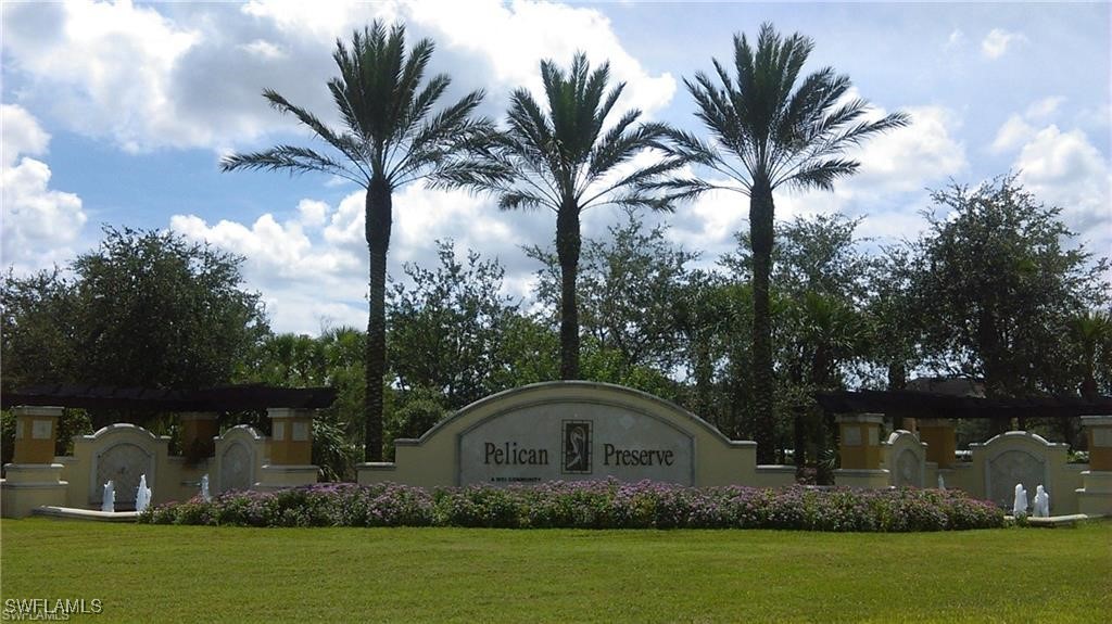 10455 Casella Way, Unit 202 Fort Myers, FL 33913 - Photo 39 of 41 a front view of a house with garden space and lake view