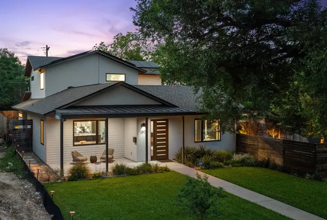 a front view of house with yard and green space