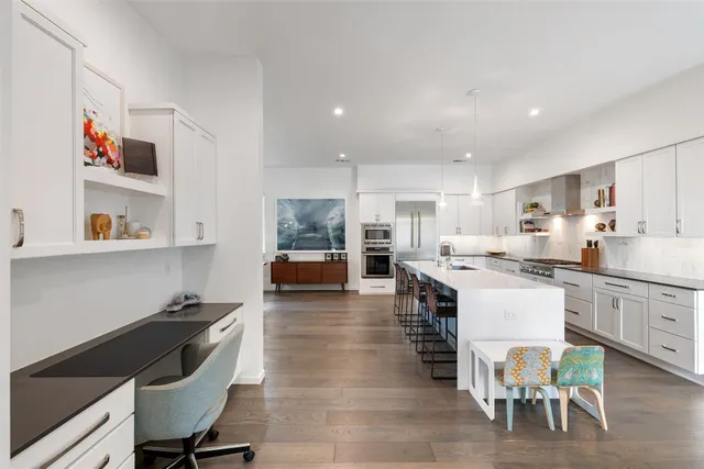 a living room with furniture a rug and a window