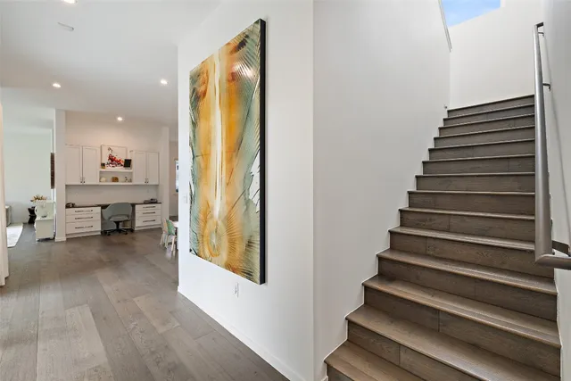 a living room with furniture and a book shelf