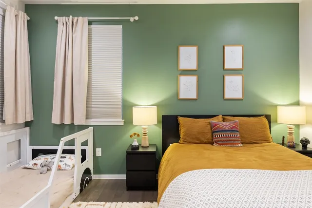 a bedroom with a bed and a window