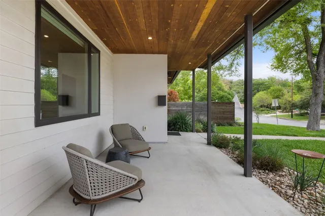 a chairs and table in backyard of house