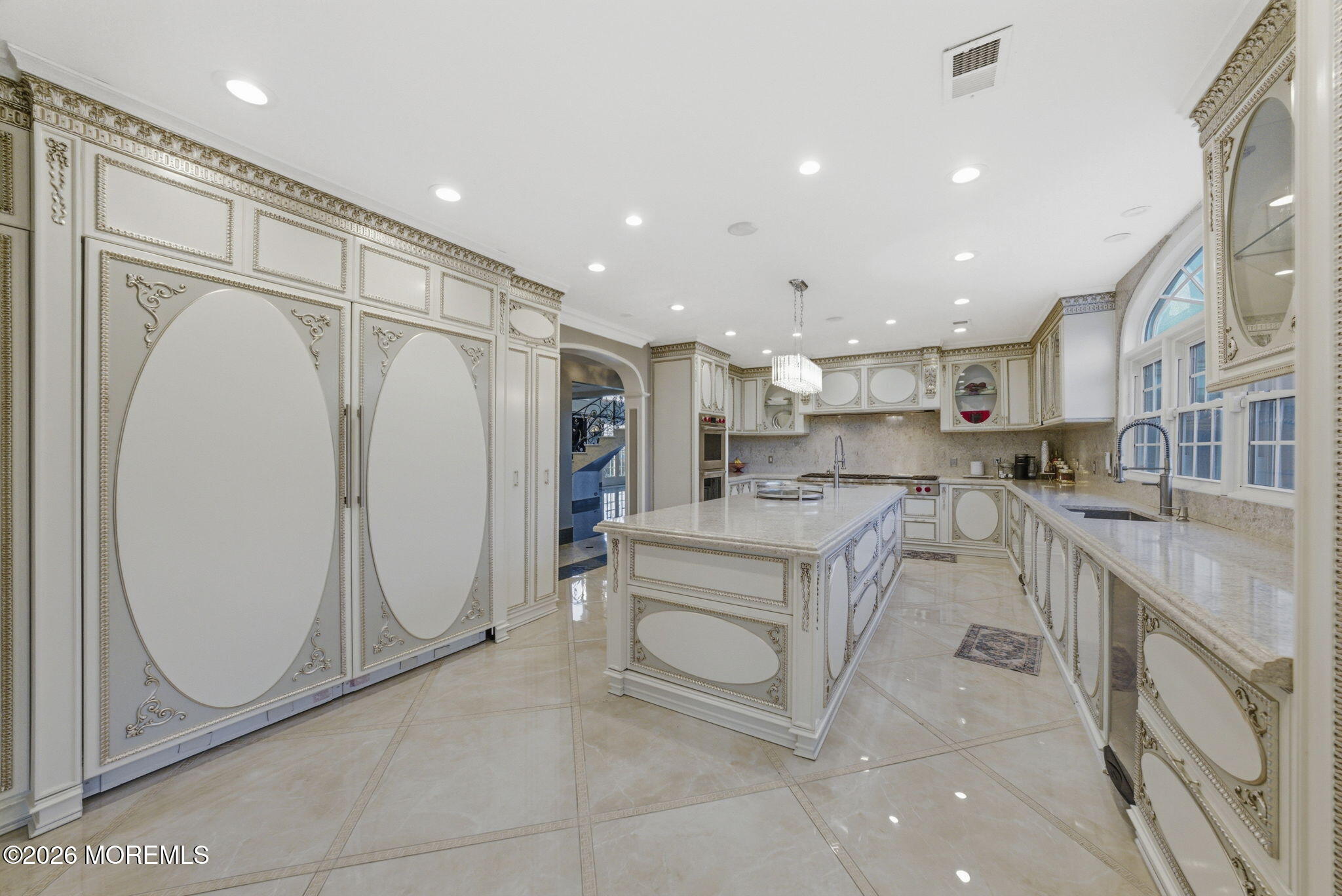 4 Squan Song Lane Colts Neck, NJ 07722 - Photo 11 of 45 a kitchen with white cabinets and refrigerator