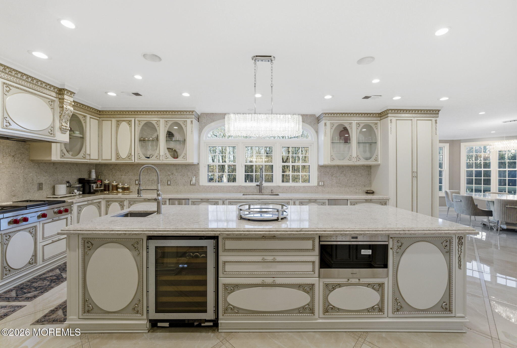 4 Squan Song Lane Colts Neck, NJ 07722 - Photo 12 of 45 a kitchen with kitchen island granite countertop a stove a sink and cabinets