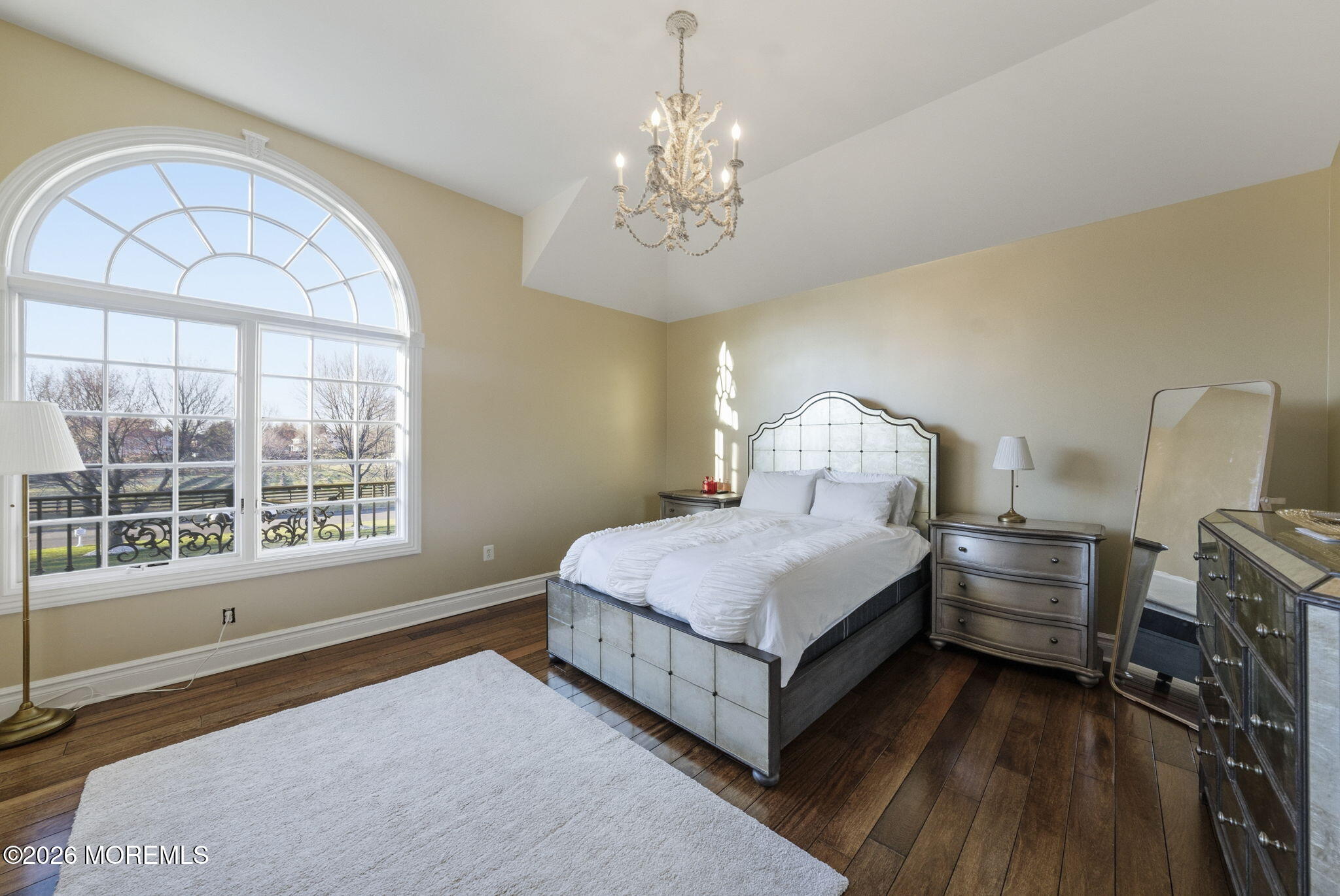 4 Squan Song Lane Colts Neck, NJ 07722 - Photo 20 of 45 a spacious bedroom with a bed and a window