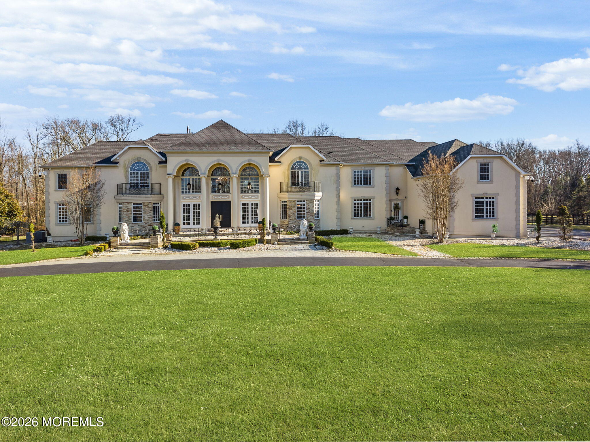 4 Squan Song Lane Colts Neck, NJ 07722 - Photo 2 of 45 a front view of building with yard and green space