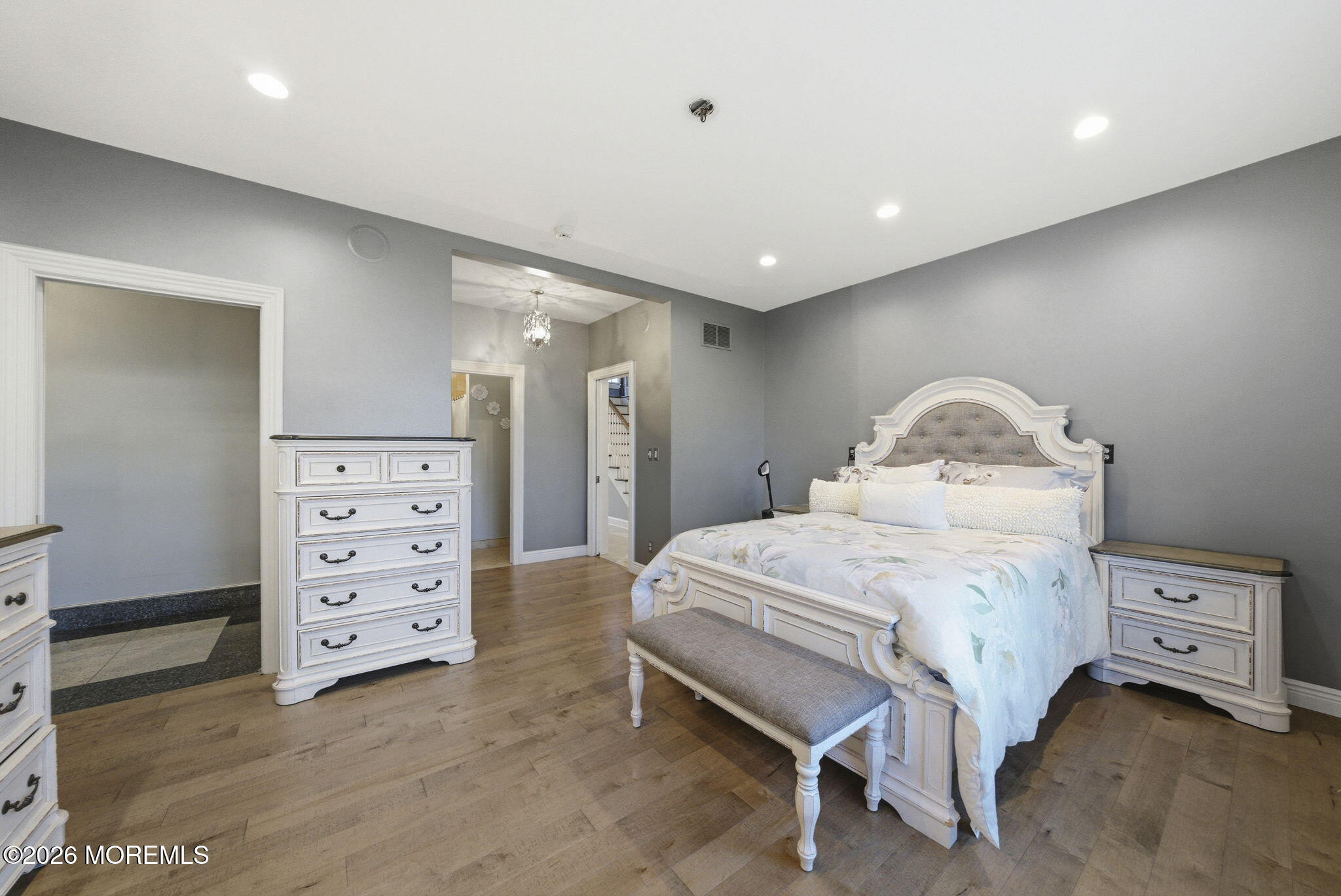 4 Squan Song Lane Colts Neck, NJ 07722 - Photo 21 of 45 a bedroom with a bed and a cabinets