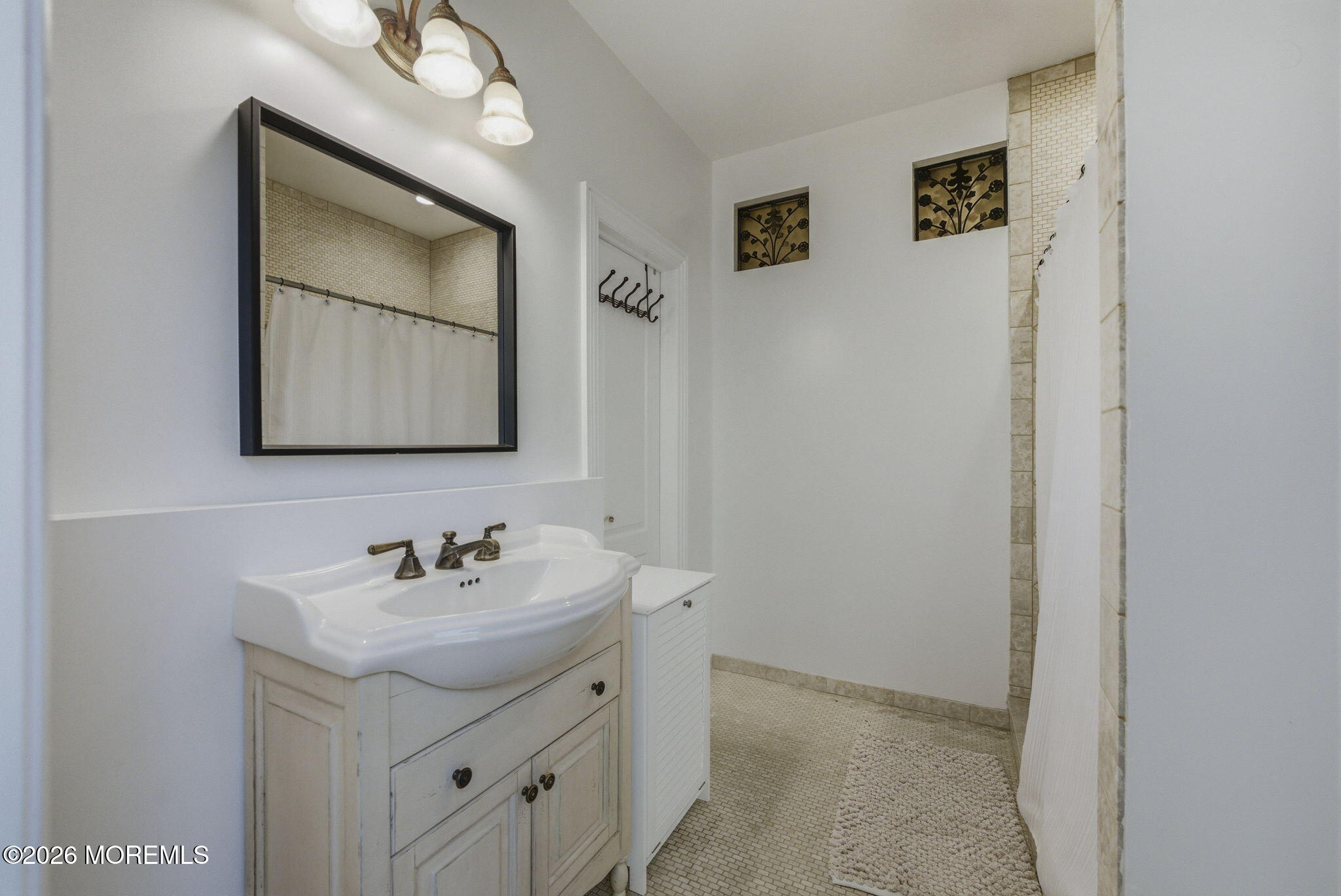 4 Squan Song Lane Colts Neck, NJ 07722 - Photo 22 of 45 a bathroom with a sink vanity and a mirror