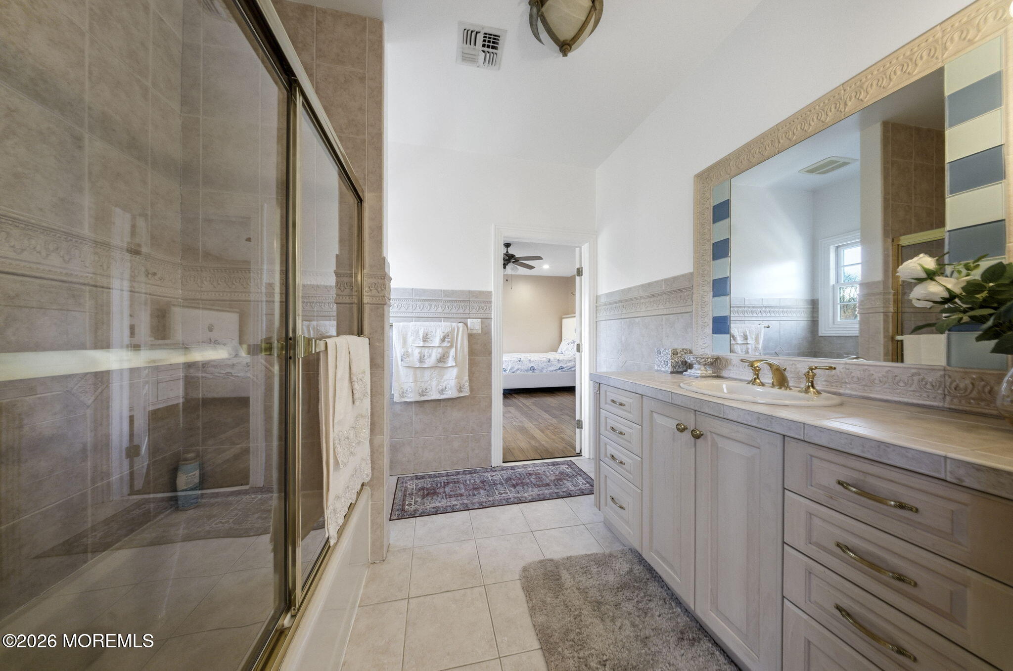 4 Squan Song Lane Colts Neck, NJ 07722 - Photo 24 of 45 a spacious bathroom with a granite countertop sink mirror and shower