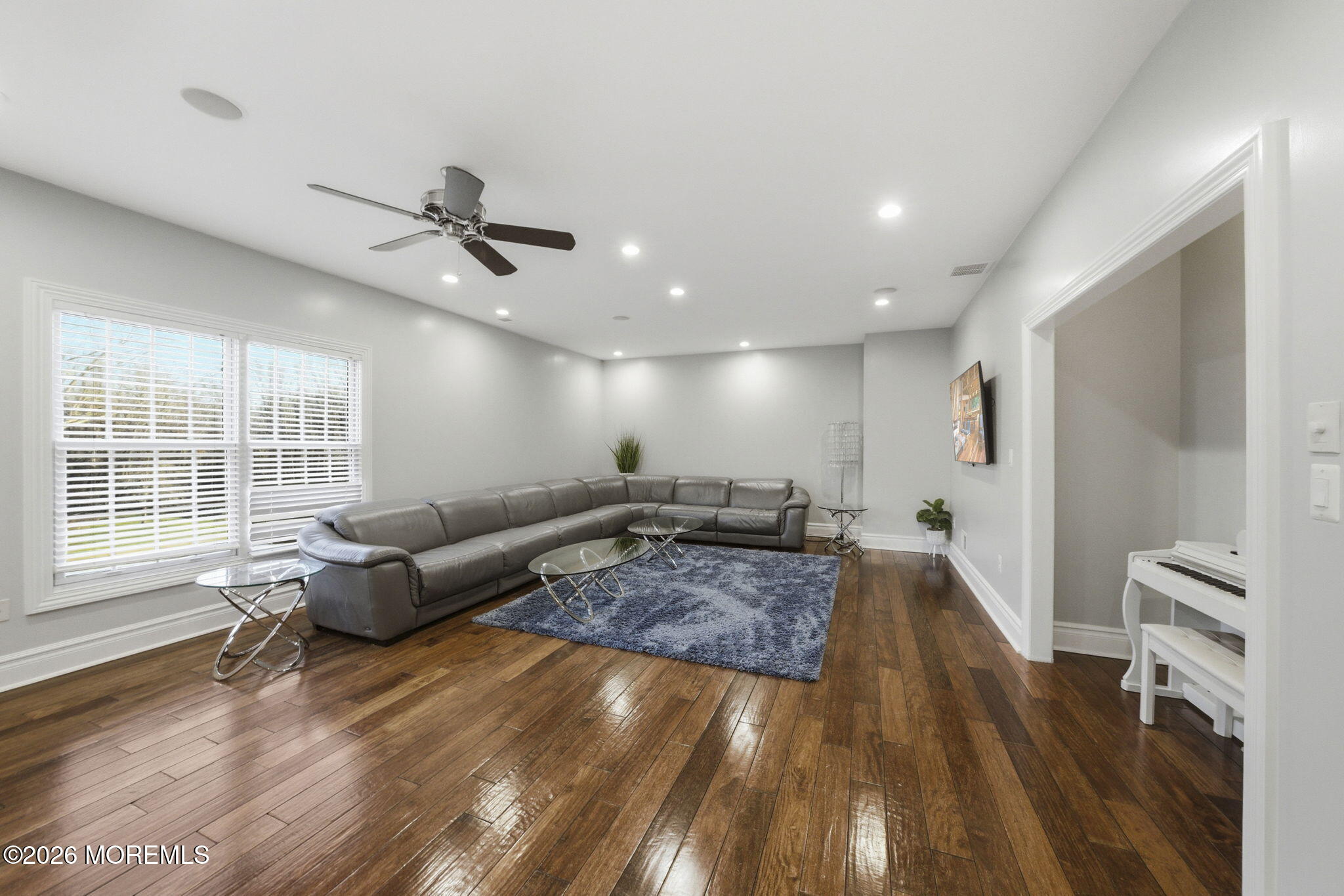 4 Squan Song Lane Colts Neck, NJ 07722 - Photo 26 of 45 a living room with furniture and a flat screen tv