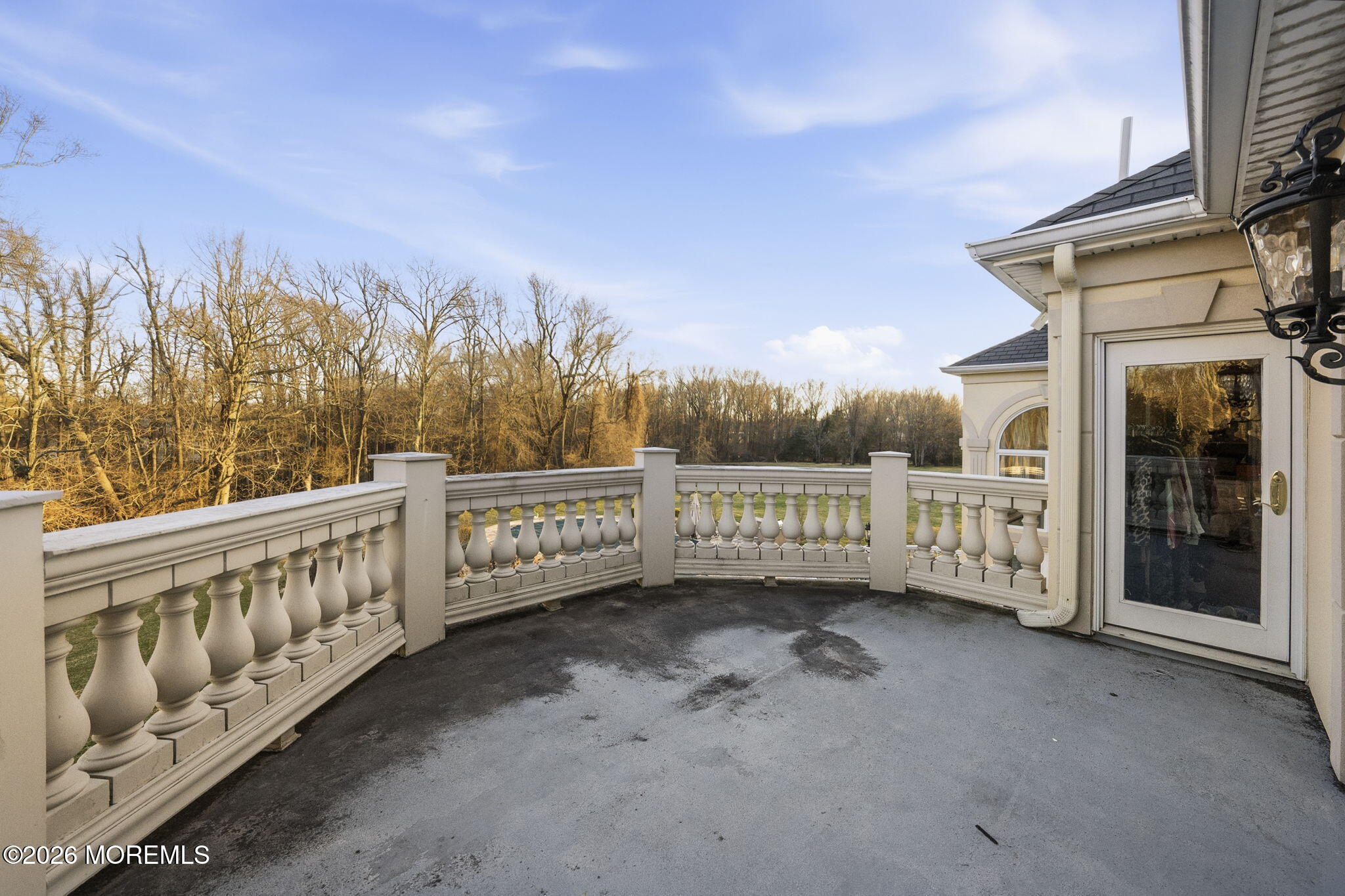 4 Squan Song Lane Colts Neck, NJ 07722 - Photo 34 of 45 a view of a balcony with wooden fence
