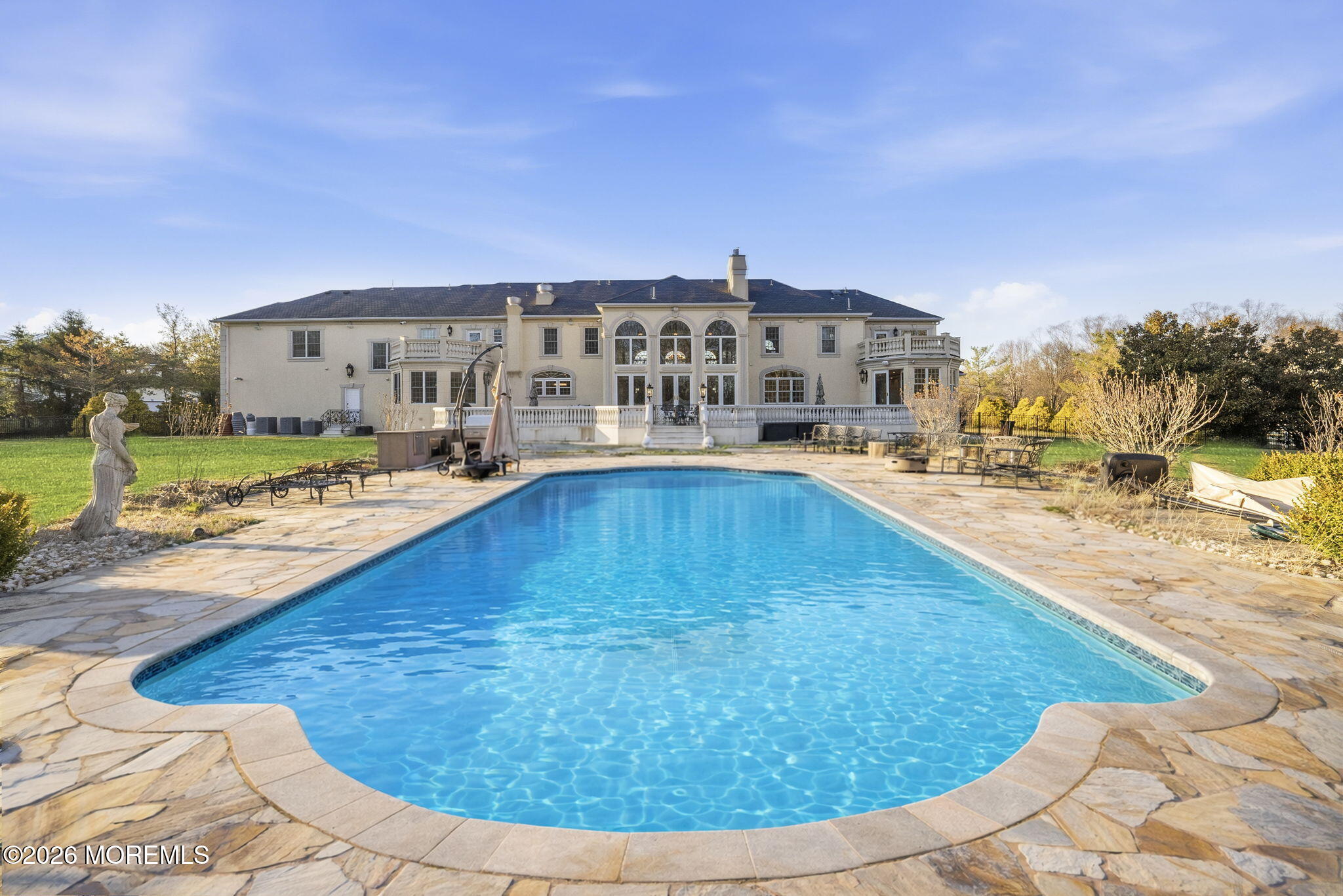 4 Squan Song Lane Colts Neck, NJ 07722 - Photo 38 of 45 a view of a swimming pool with an outdoor space