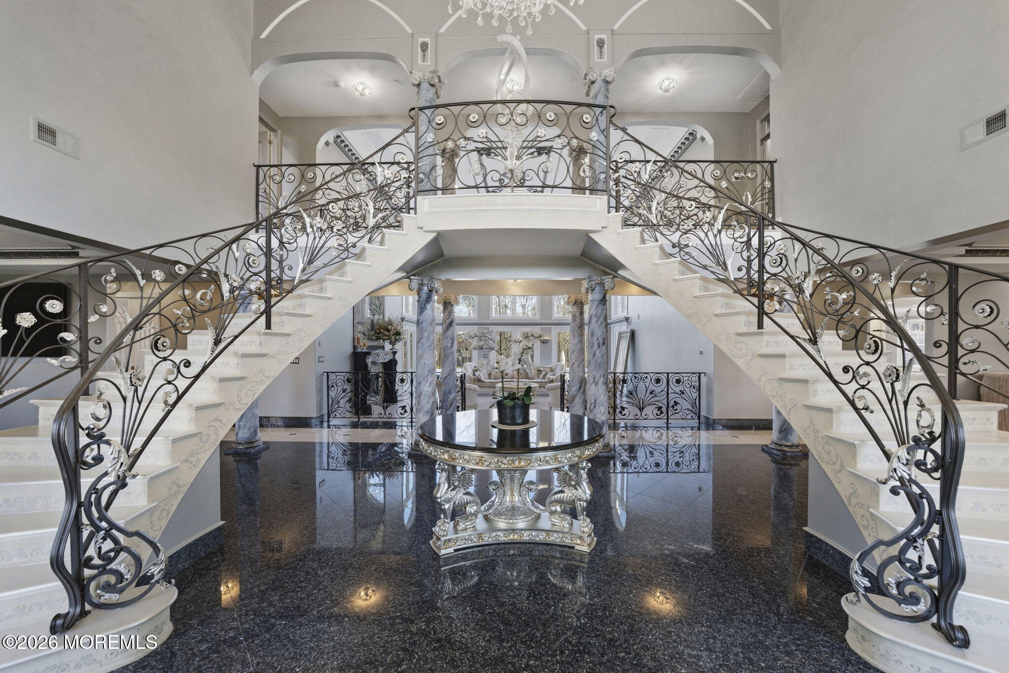 4 Squan Song Lane Colts Neck, NJ 07722 - Photo 4 of 45 a view of entryway and hall with a chandelier