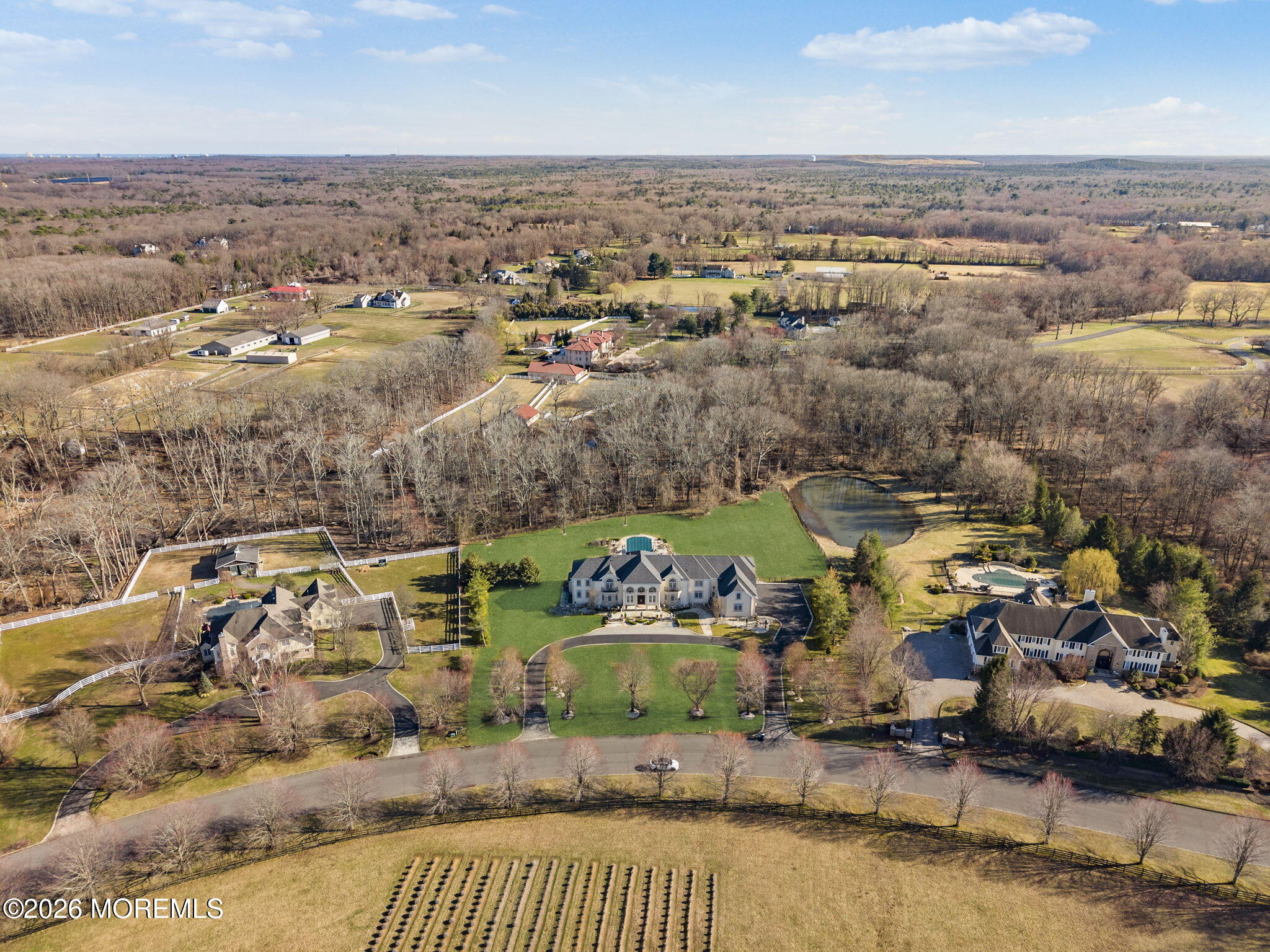 4 Squan Song Lane Colts Neck, NJ 07722 - Photo 41 of 45 an aerial view of a houses with a lake