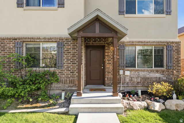 1165 West 100 South Springville, UT 84663 - Photo 21 of 28 Doorway to property with stucco siding and brick siding