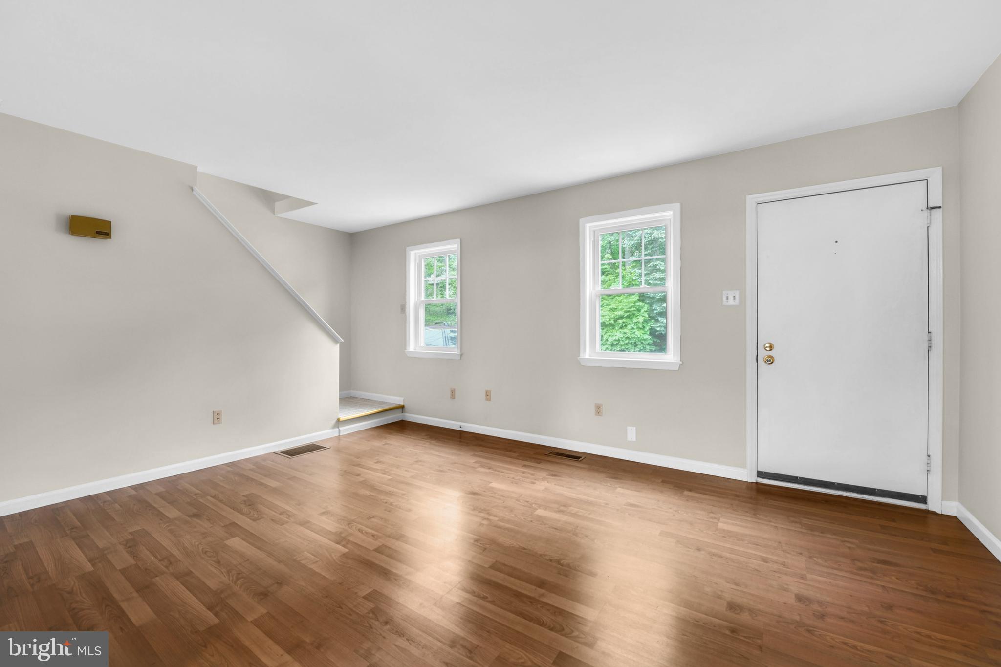 19 Reed Street Mohnton, PA 19540 - Photo 3 of 18 an empty room with wooden floor and windows
