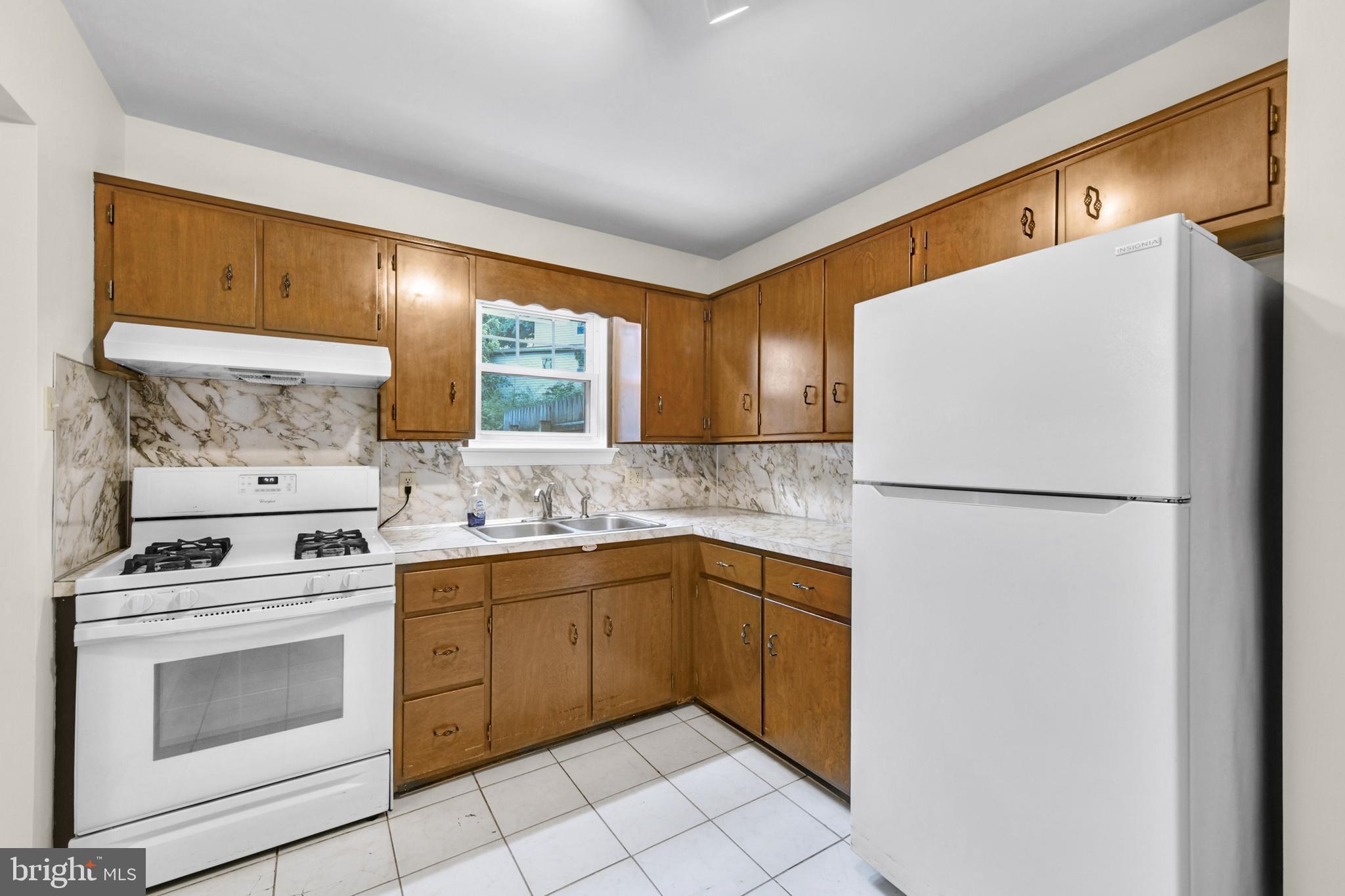 19 Reed Street Mohnton, PA 19540 - Photo 9 of 18 a kitchen with a white cabinets and white appliances