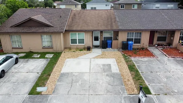 a front view of a house with fountain and furniture