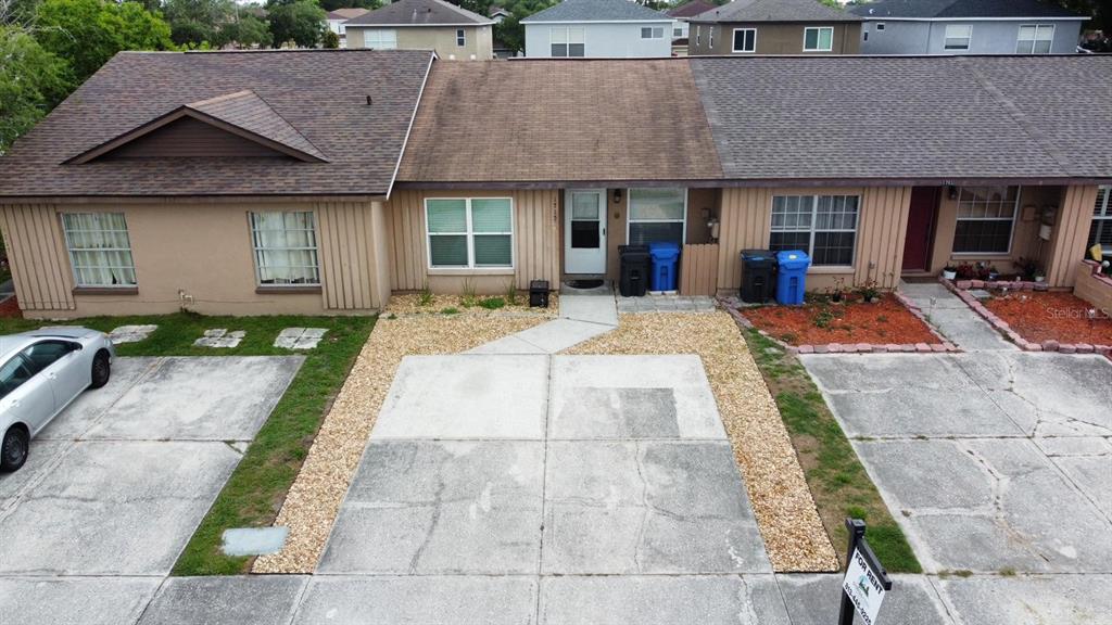 1715 Oak Branch Court, Unit 1715 Brandon, FL 33511 - Photo 1 of 15 a front view of a house with fountain and furniture