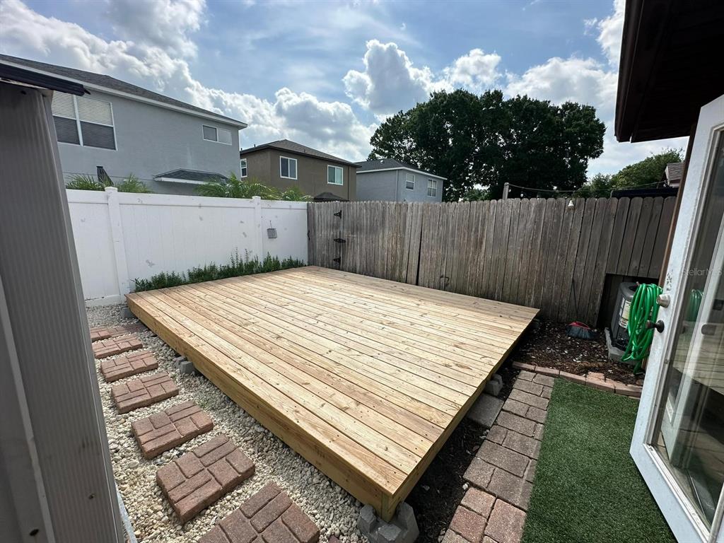 1715 Oak Branch Court, Unit 1715 Brandon, FL 33511 - Photo 14 of 15 a view of a backyard with wooden fence