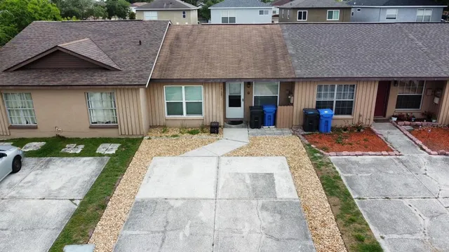 a front view of a house with garden and porch