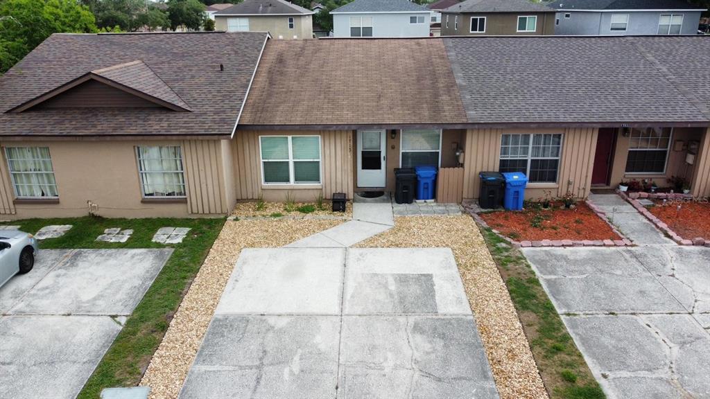 1715 Oak Branch Court, Unit 1715 Brandon, FL 33511 - Photo 2 of 15 a front view of a house with garden and porch