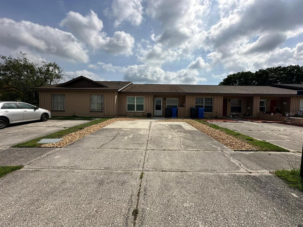 1715 Oak Branch Court, Unit 1715 Brandon, FL 33511 - Photo 3 of 15 a view of a white house with a patio