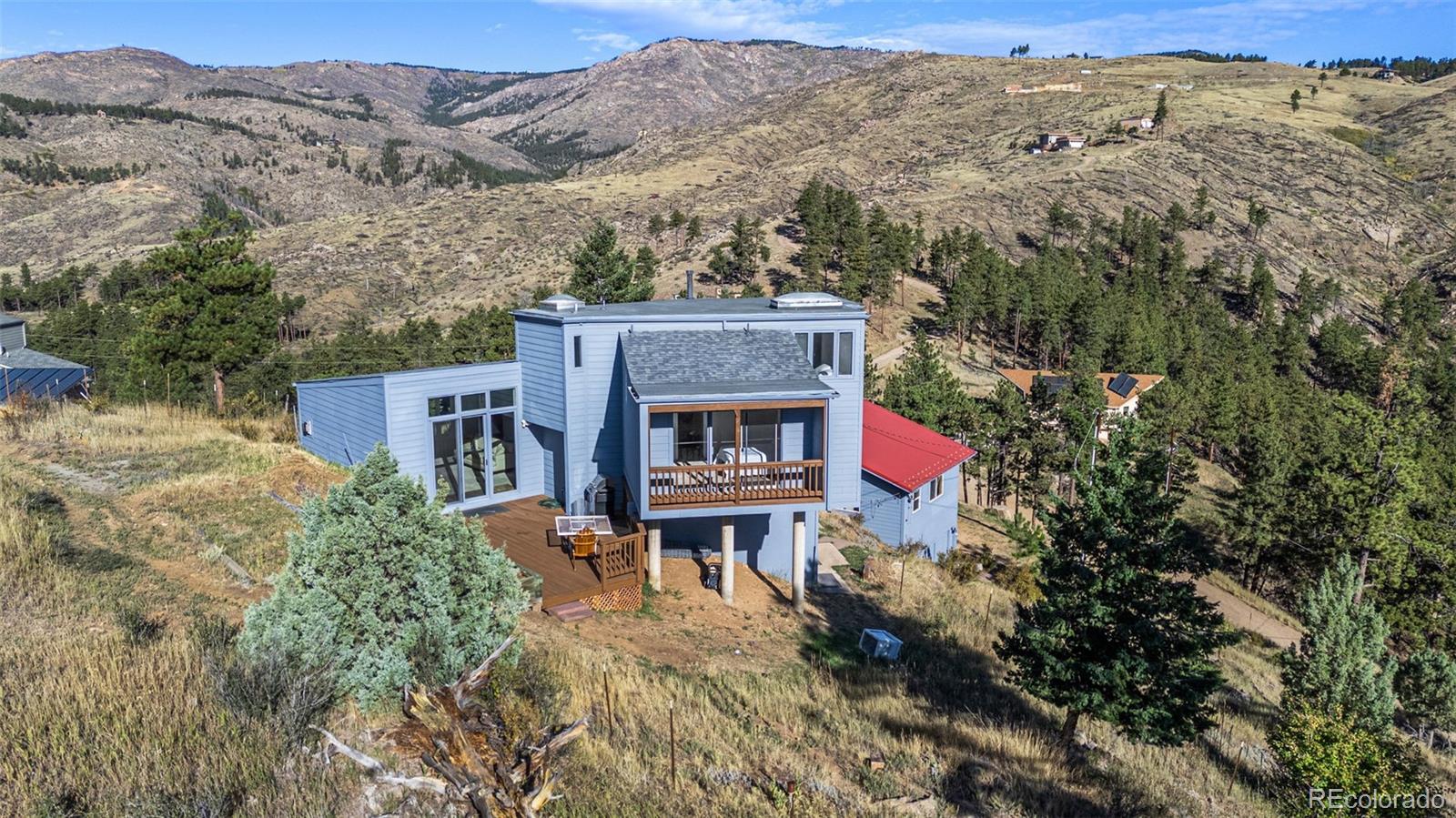 319 Camino Bosque Boulder, CO 80302 - Photo 1 of 44 an aerial view of house with yard and mountain view in back