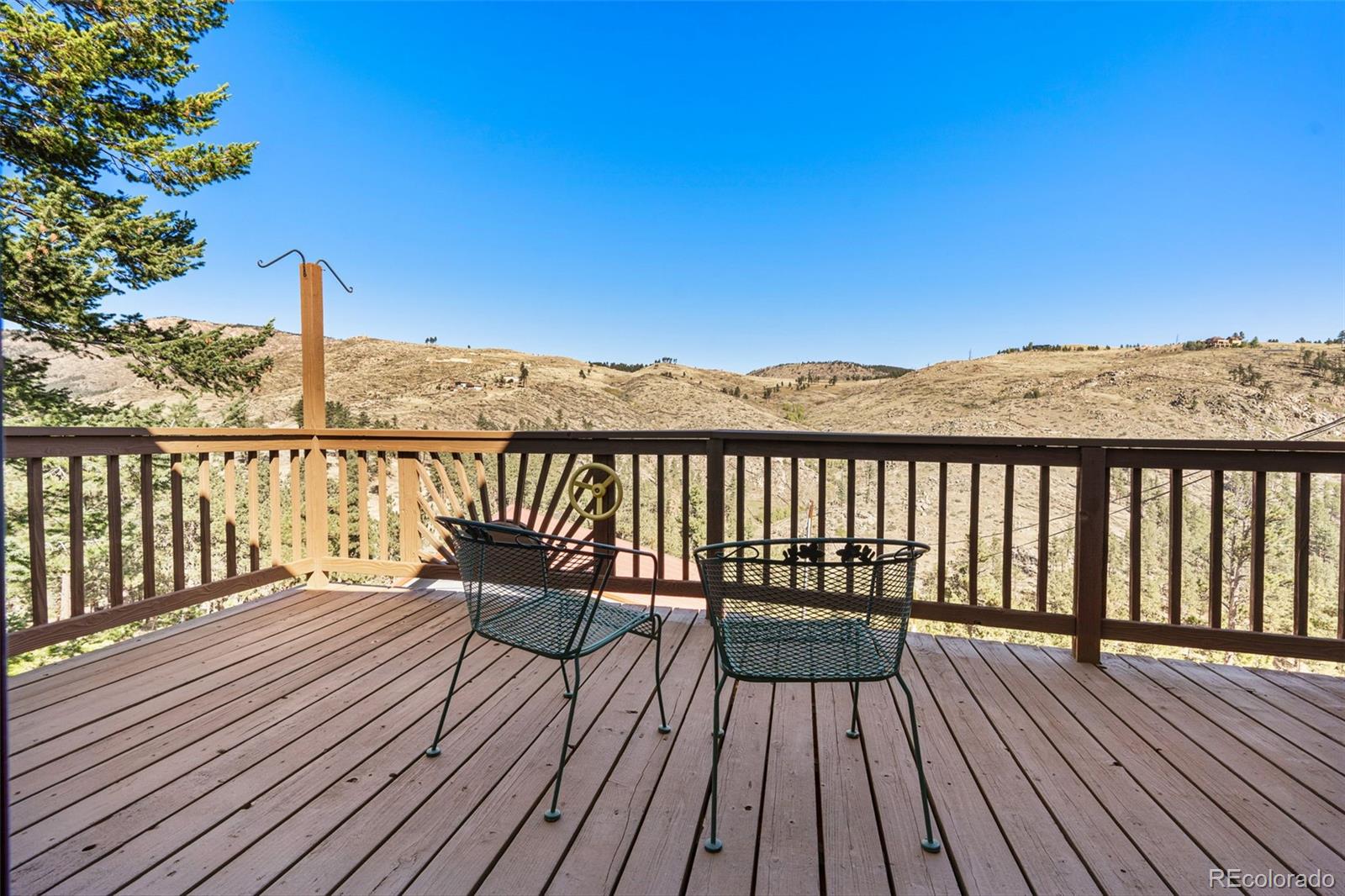 319 Camino Bosque Boulder, CO 80302 - Photo 15 of 44 a view of a balcony with wooden floor and fence