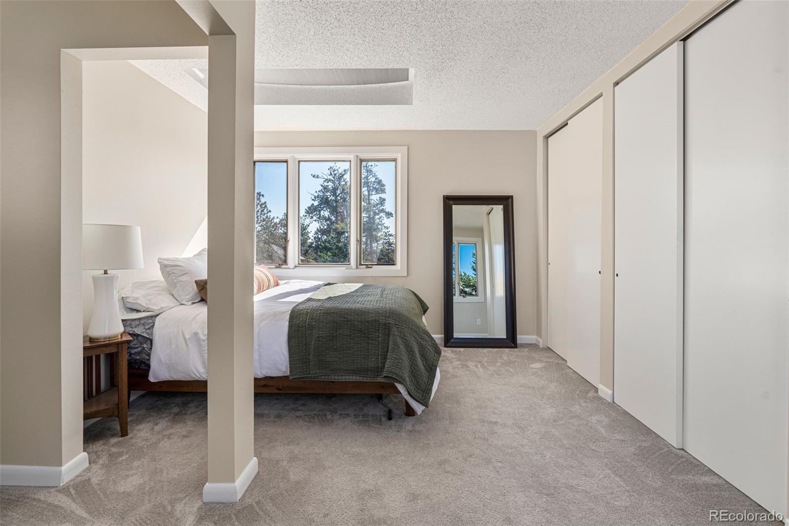 319 Camino Bosque Boulder, CO 80302 - Photo 22 of 44 a bedroom with a bed and a window