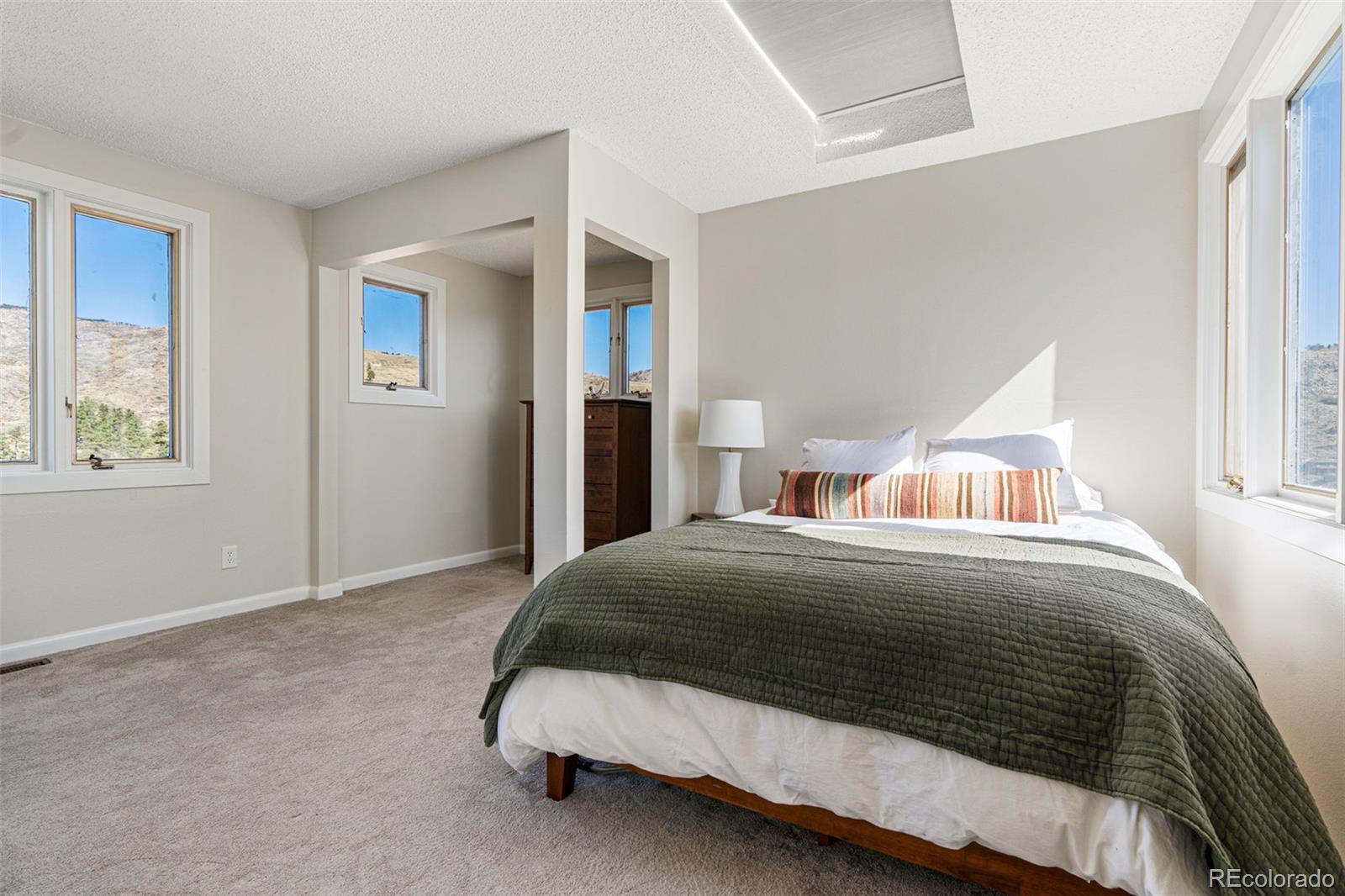 319 Camino Bosque Boulder, CO 80302 - Photo 23 of 44 a bedroom with a bed and window