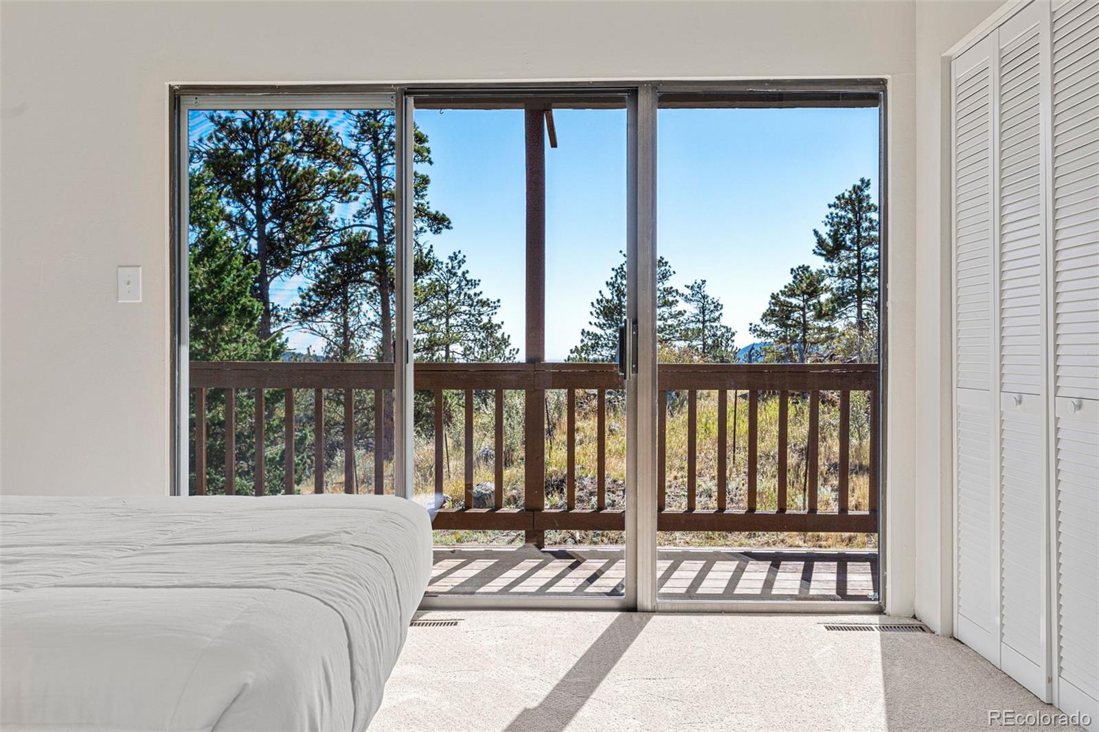 319 Camino Bosque Boulder, CO 80302 - Photo 27 of 44 a bed sitting in front of a window